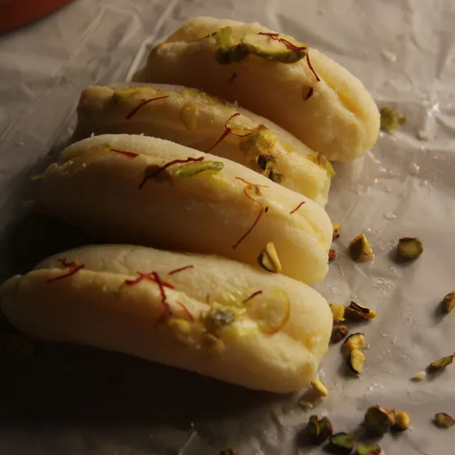 Cham cham garnished with saffron and pistachio