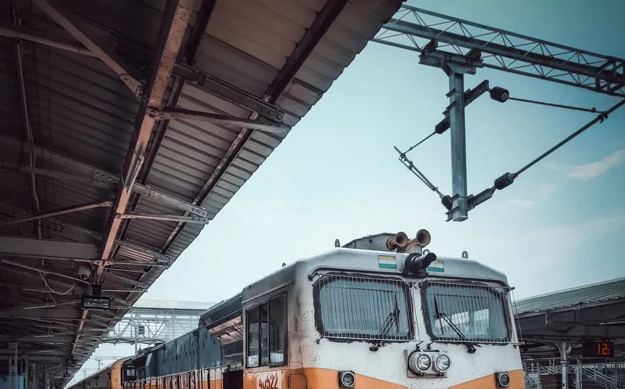 An Indian Railways train waiting at a station platform