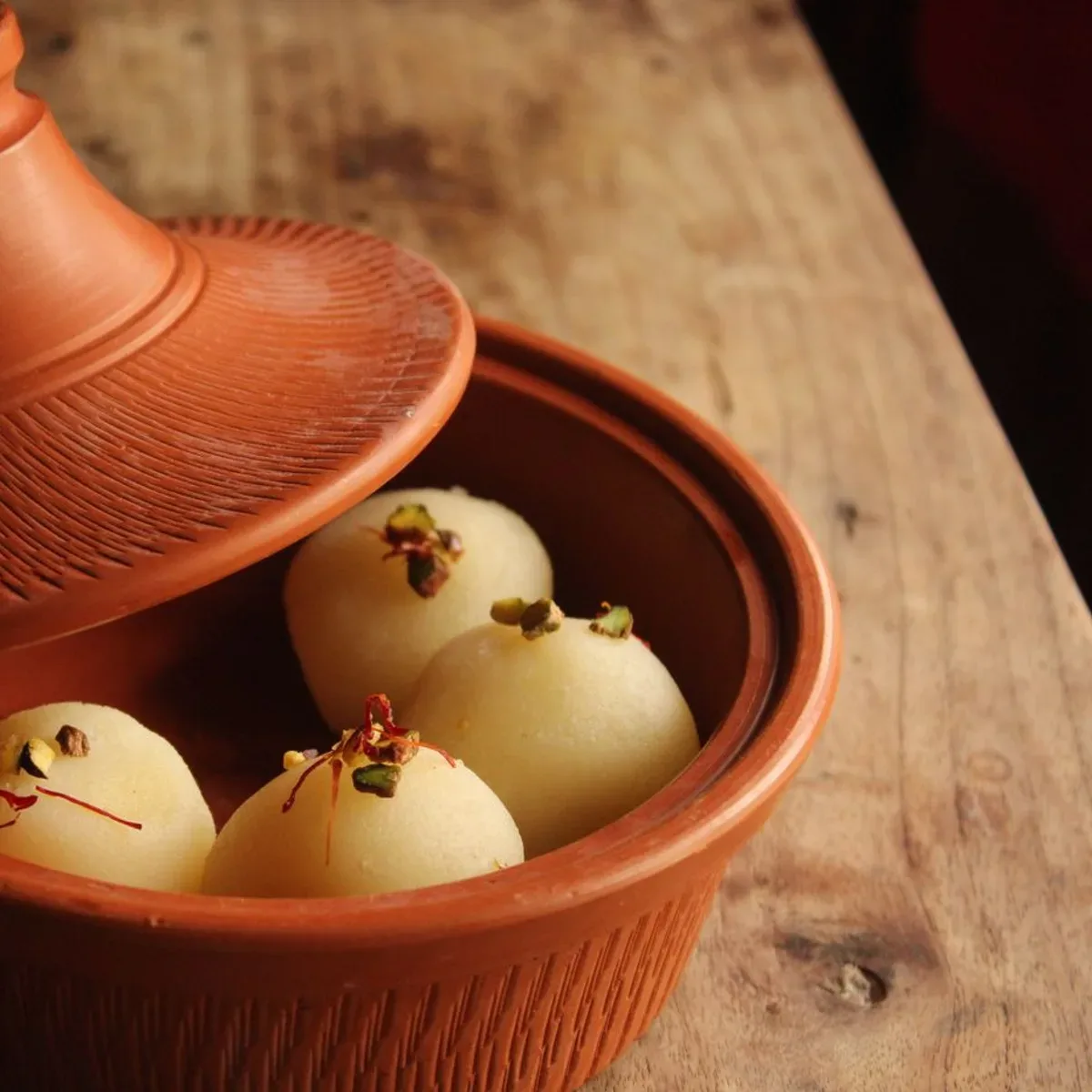 Saffron rajbhog in a clay pot